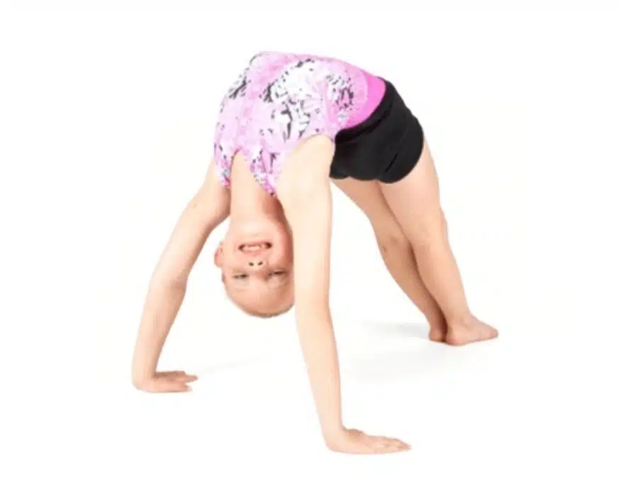 Pivot - Beginner Acro Young girl in a pink and black leotard performs a backbend, smiling upside down in a dance studio against a white background.